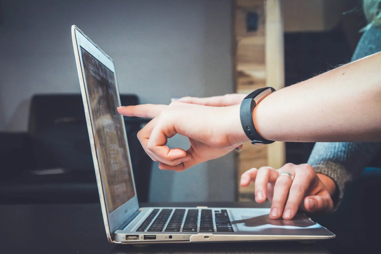 Person working on a laptop during an online learning or assistance session
